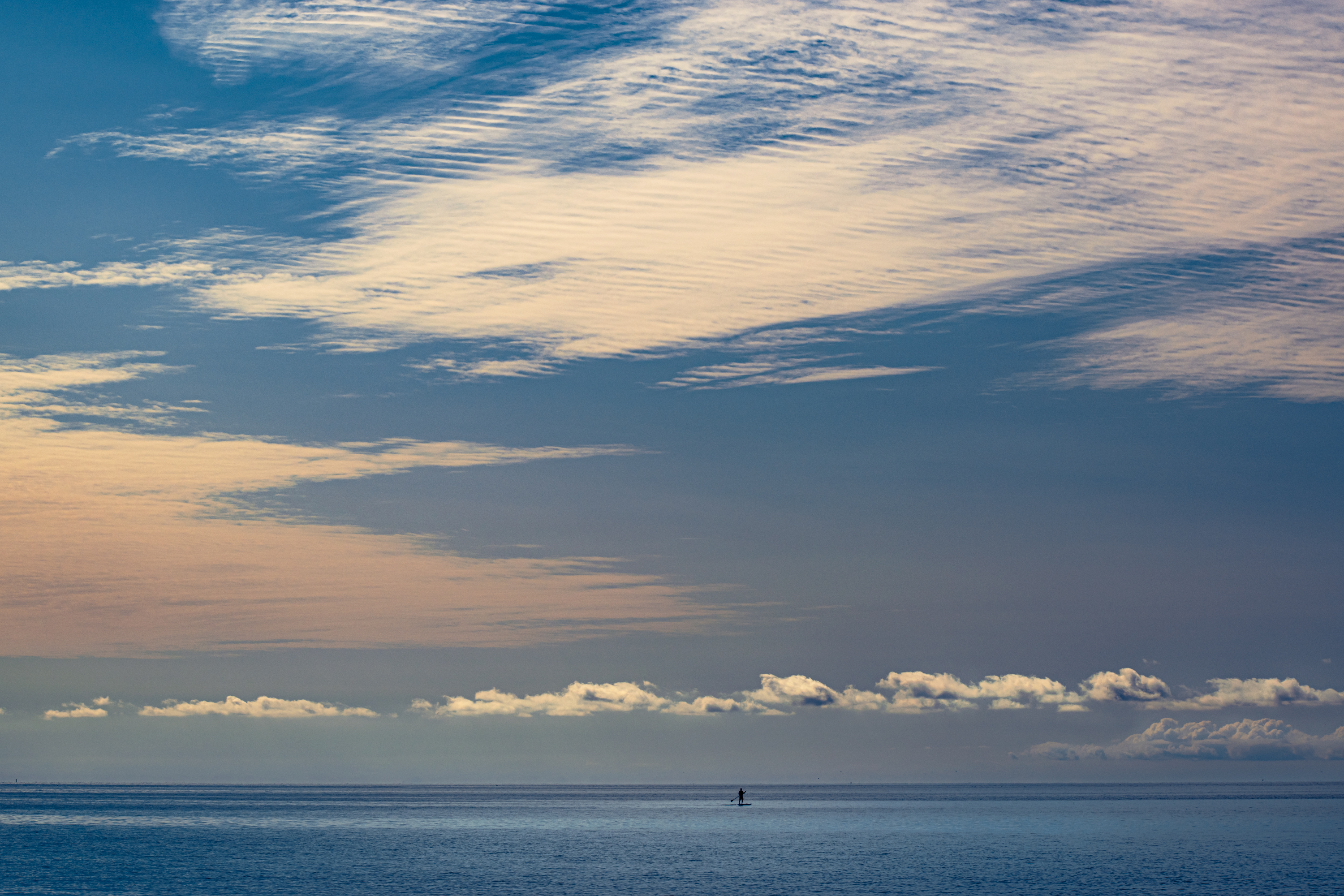 Man on a paddleboard, beautiful morning