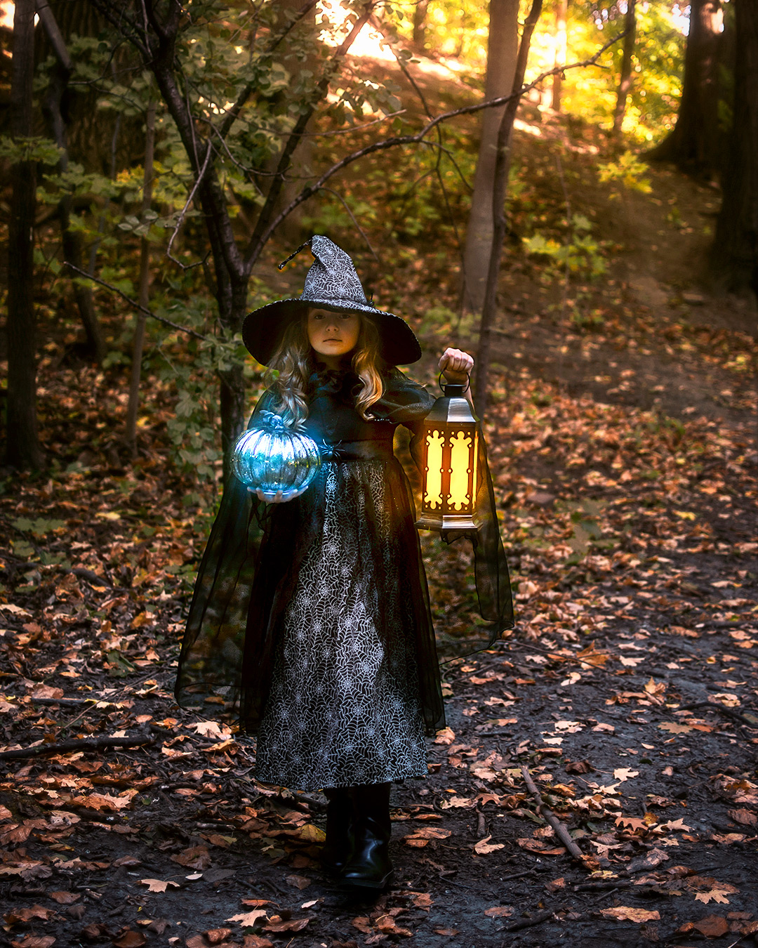 Girl with a magic pumpkin and lantern